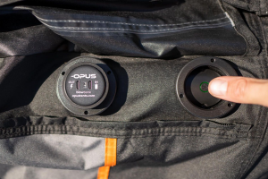 An image showing a person pressing the button of the self inflating opus smart tent