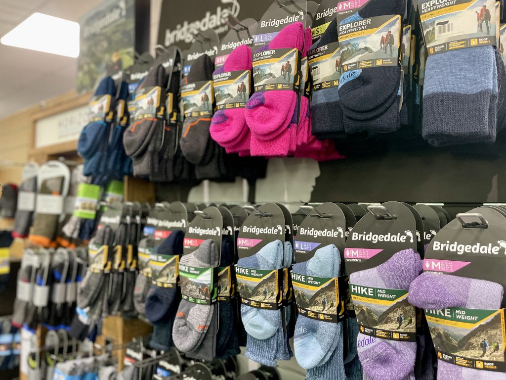a range of colourful sock display from Bridgedale Hiking socks