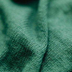 close up of  knitted fabric in green